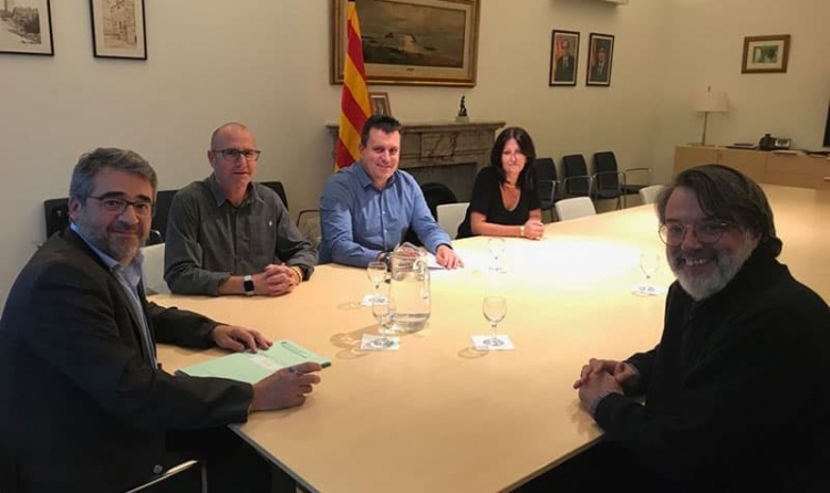 Jordi Madrid i Josep Llopart, al centre de la imatge, en la reunió amb els responsables dels Mossos